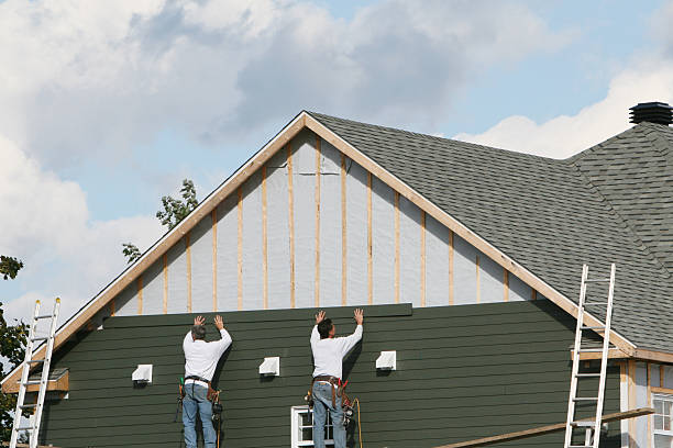 Professional Storm Damage Siding Repair technician working in McLean, VA